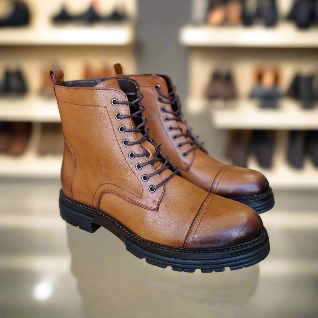 commercial photography , neutral lighting in a store of shoes with back spotlight and shoes in background
