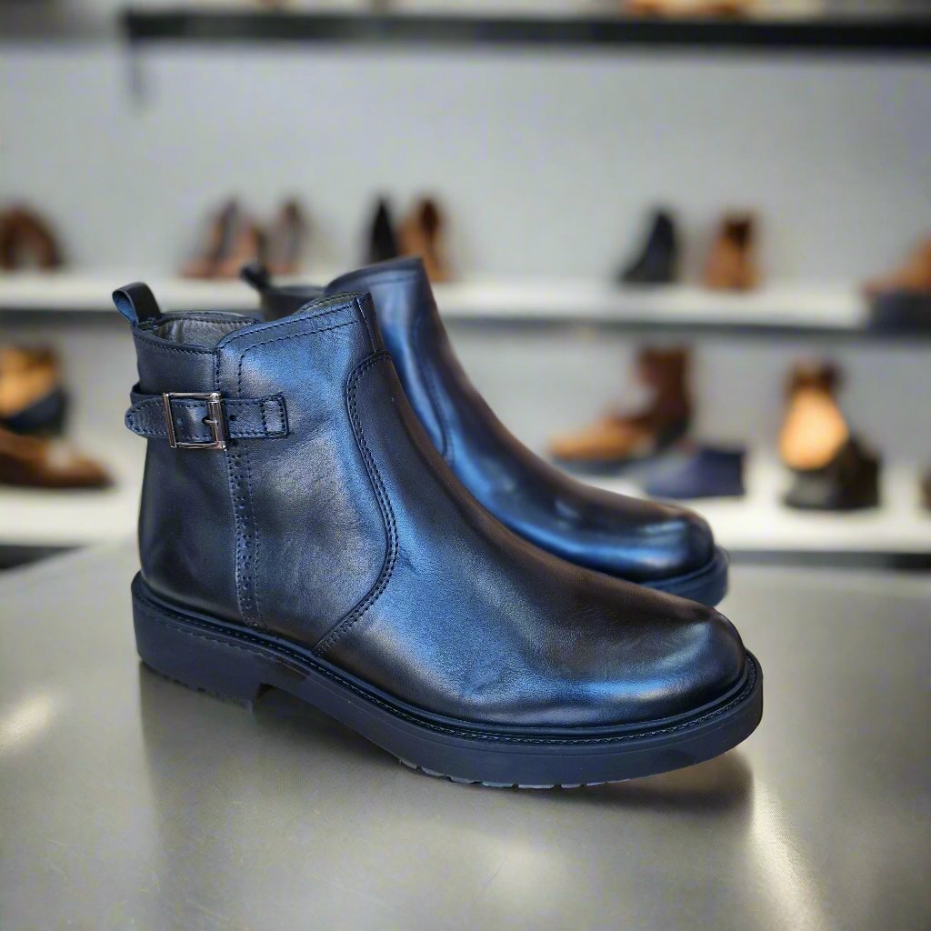 commercial photography , neutral lighting in a store of shoes with back spotlight and shoes in background
